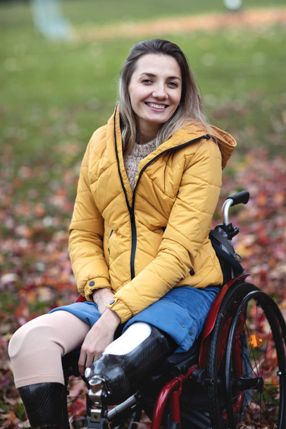 Beautiful disabled woman sitting in a special chair. - Foto, Bild