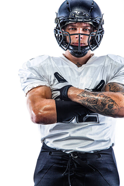American football player in helmet isolated on white background. Sport wallpaper. - 写真・画像