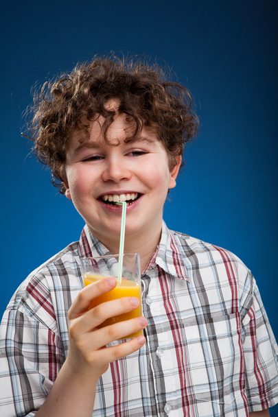 Boy with orange juice - Photo, Image