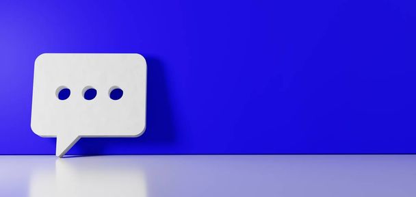 Rendering 3D del simbolo bianco dell'icona della bolla di chat arrotondata appoggiata sulla parete a colori con riflesso del pavimento con spazio vuoto sul lato destro
 - Foto, immagini