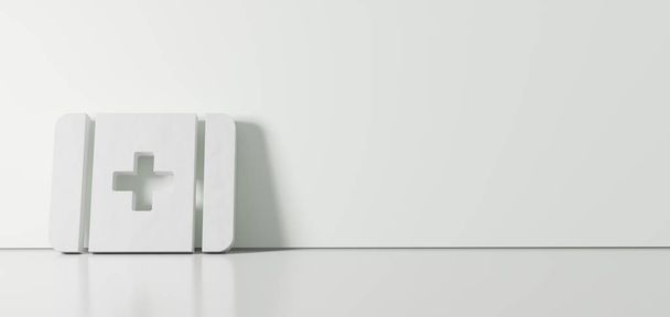 Renderização 3D do símbolo branco do ícone de primeiros socorros apoiado na parede colorida com reflexão no chão com espaço vazio no lado direito
 - Foto, Imagem