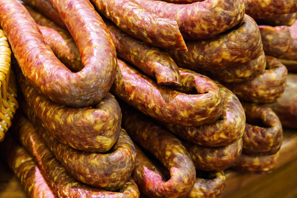 Food plat with delicious salami, pieces of sliced ham, sausage, cooked in a traditional way. - Foto, afbeelding