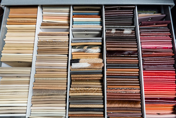 Multi-color leather sheet in sample box with in natural light setting scene / interior design / sample material - Foto, Bild