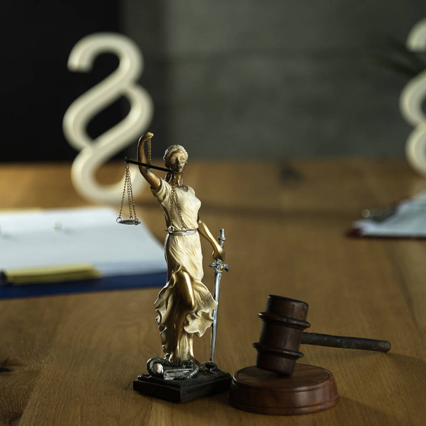 Gavel on wooden table background with blurred books - Photo, Image