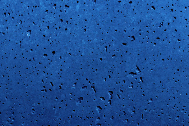 Beautiful navy blue grunge background with copy space, abstract stucco wall texture with holes and scuffs - Photo, Image
