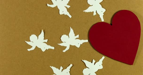 Animated stop motion. Angels cupids fly out of heart. Valentine's day concept - Footage, Video