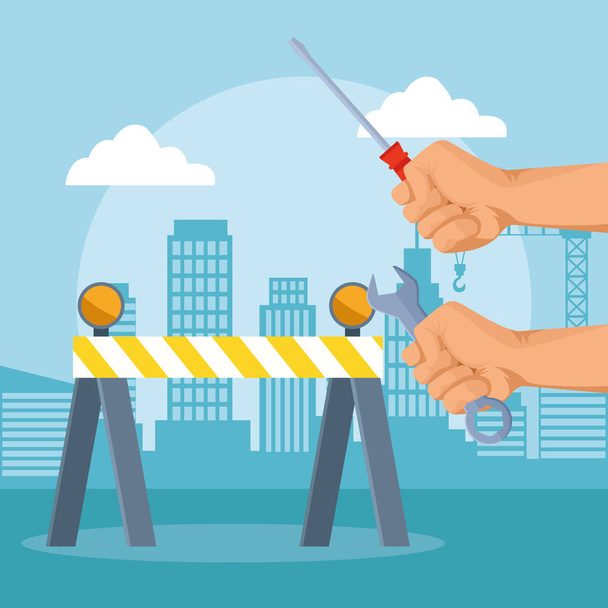 road barrier and hands holding tools over under construction scenery background - Vector, Image