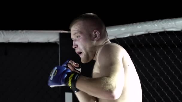 Fight in the MMA octagon. Slow motion. Kyiv. Ukraine - Кадры, видео