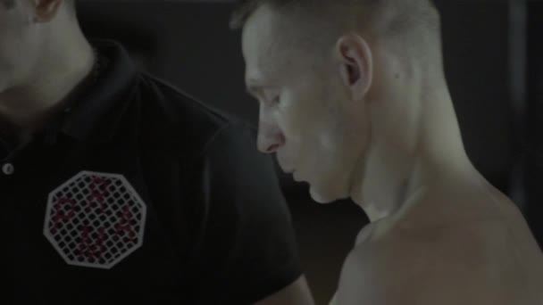 A male fighter in the MMA octagon. Slow motion. Kyiv. Ukraine - Video, Çekim
