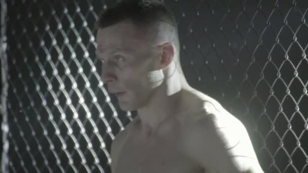 A male fighter in the MMA octagon. Slow motion. Kyiv. Ukraine - Záběry, video