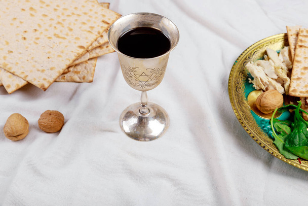 Jewish Pesah celebrating, matzoh and traditional seder plate - Photo, Image