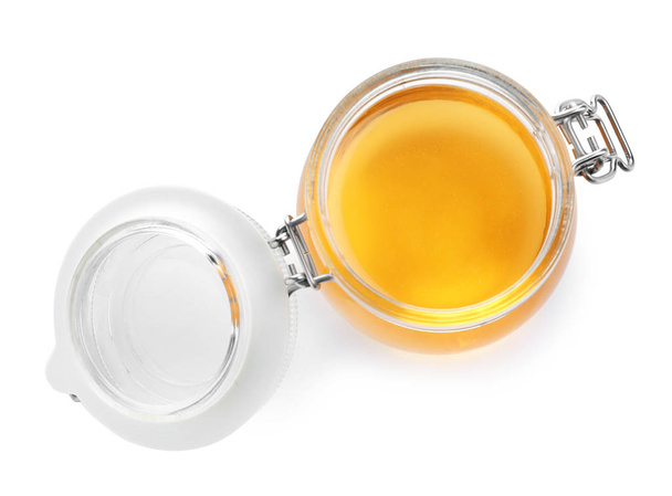 Jar of organic honey isolated on white, top view - Valokuva, kuva