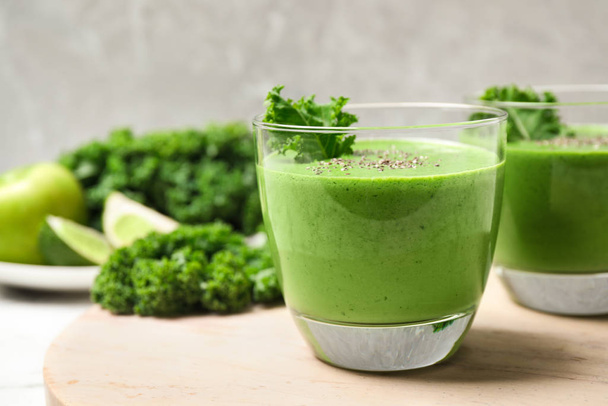 Tasty kale smoothie with chia seeds on table, closeup - 写真・画像