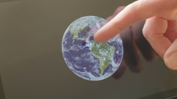 A caucasian man pointing at a view of the earth on a screen themes of astronomy science earth space - Created with public domain images from Nasa - Filmati, video