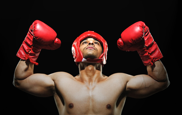 Male boxer with arms over his head - Photo, image