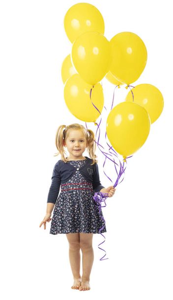 3 year old girl holding a group of yellow balloons. - Φωτογραφία, εικόνα