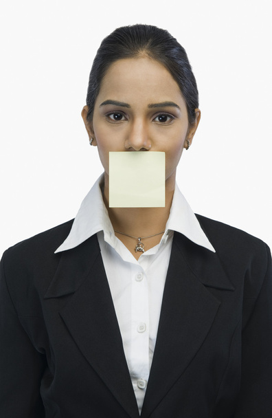 Businesswoman with an adhesive note on his mouth - Fotoğraf, Görsel