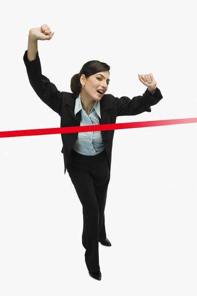 Businesswoman crossing the finishing line - Photo, Image