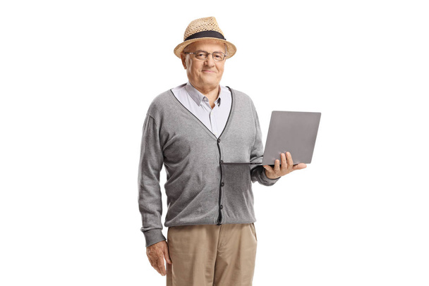 Senior gentleman standing with a laptop - Photo, Image