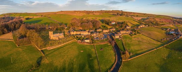 Aerial Panorama shot of the village of Bradfield in the Peak District National Park, English Countryside during a beautiful winter sunset - Photo, Image