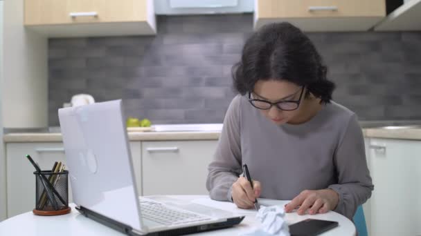 Female writer crumpling paper, throwing away, lack of inspiration, startup ideas - Кадри, відео
