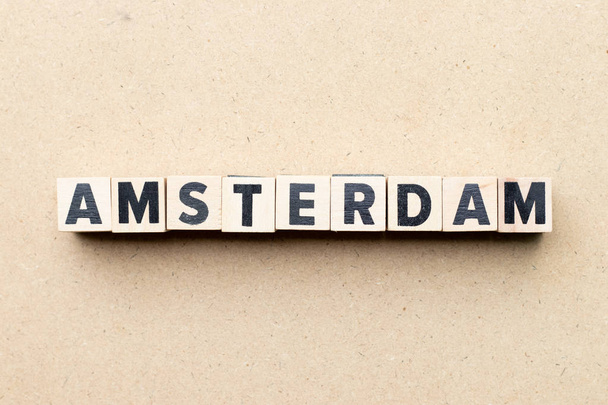 Letter block in word Amsterdam on wood background - Foto, imagen