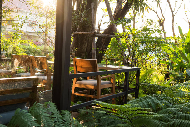 Coffee shop patio with spring garden - 写真・画像