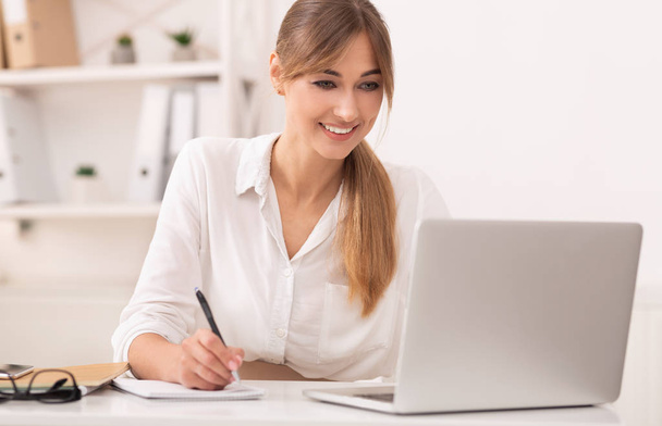 Cheerful Secretary Girl Taking Notes Sitting In Modern Office - Photo, Image