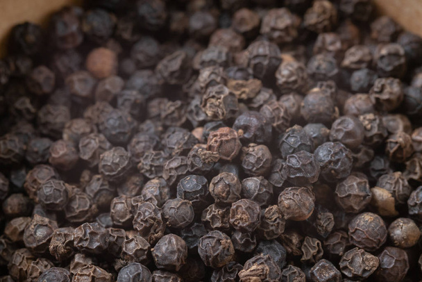 close up of pile black pepper grains - Φωτογραφία, εικόνα