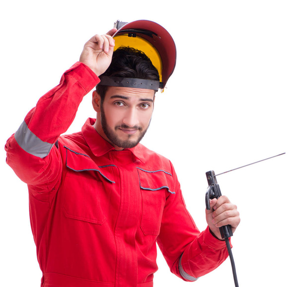 Jeune réparateur avec une électrode de pistolet à souder et un isolat casque
 - Photo, image