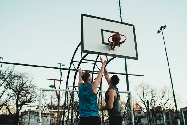 Young basketball players playing one-on-one. - Zdjęcie, obraz
