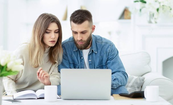 Confident couple trying to manage domestic finances - Photo, Image