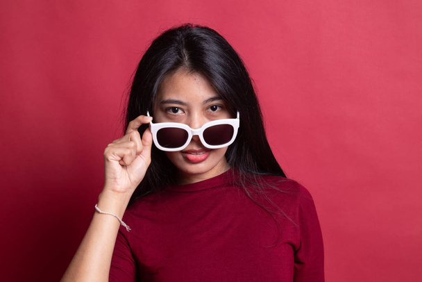 Portrait of a beautiful young asian girl in sunglasses. - Fotografie, Obrázek