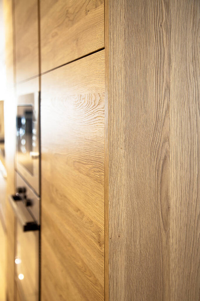 Interior of modern kitchen, oak cabinets corner - Foto, afbeelding