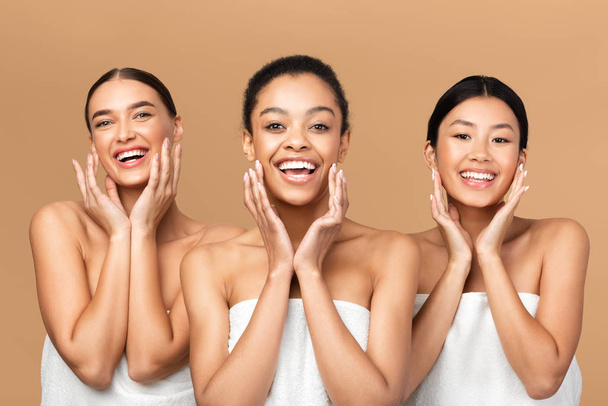 Three Girls Touching Face With Smooth Skin On Beige Background - Photo, Image