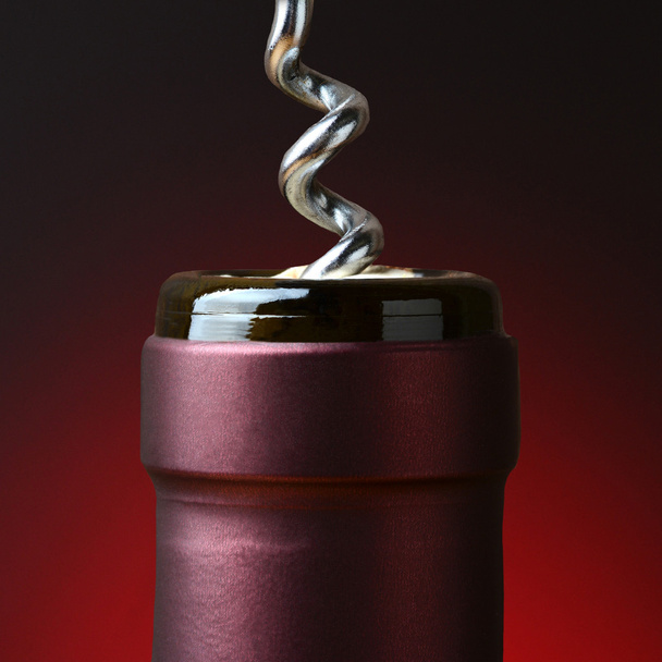 Wine Bottle and Corkscrew Closeup - Fotó, kép