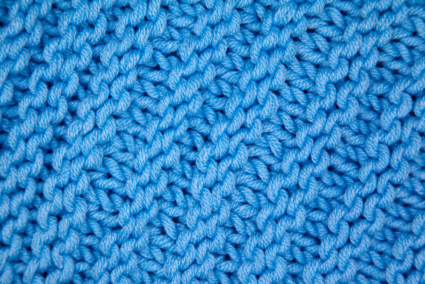 Handgemaakte gebreide stof blauwe wol achtergrond textuur - Foto, afbeelding