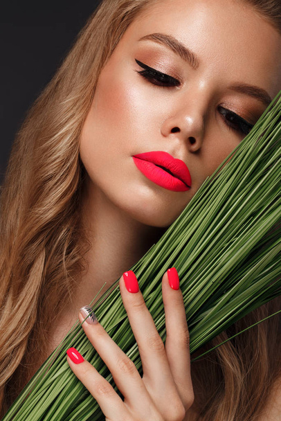 Beautiful young woman with bright makeup and neon pink nails. Beauty face. - Photo, image