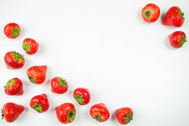 Strawberry on white background, top view. Berries pattern. Fresh strawberry isolated on white background - Zdjęcie, obraz