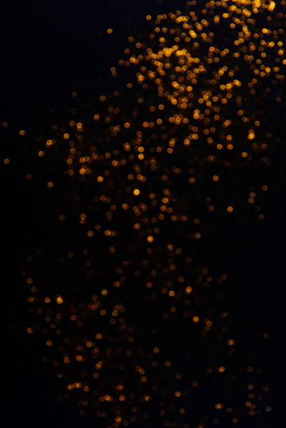 Beautiful blurred golden background on black - Фото, изображение