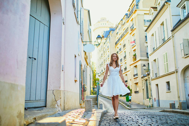 Young woman walking on Montmartre hill in Paris - Fotoğraf, Görsel