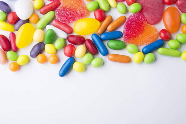 Border of colorful jelly candies on white - Valokuva, kuva