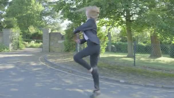 Senior school girl practising ballet on the way to school themes of ballet carefree routines education  - Filmagem, Vídeo