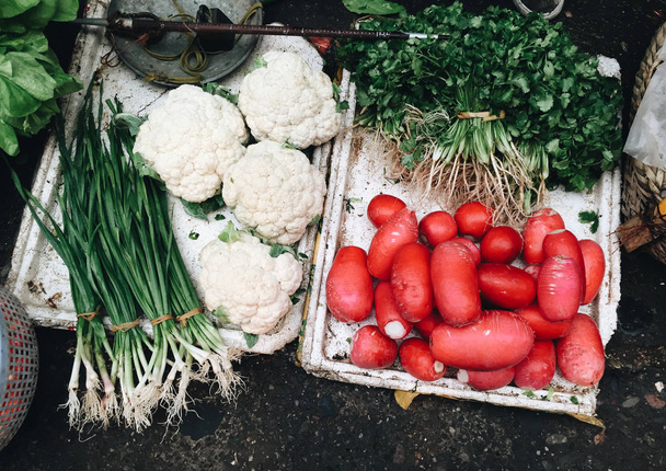 Fresh vegetables and fruits at local market - Fotoğraf, Görsel