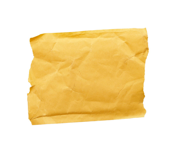 square piece of yellow paper with torn edges isolated on a white - Photo, Image