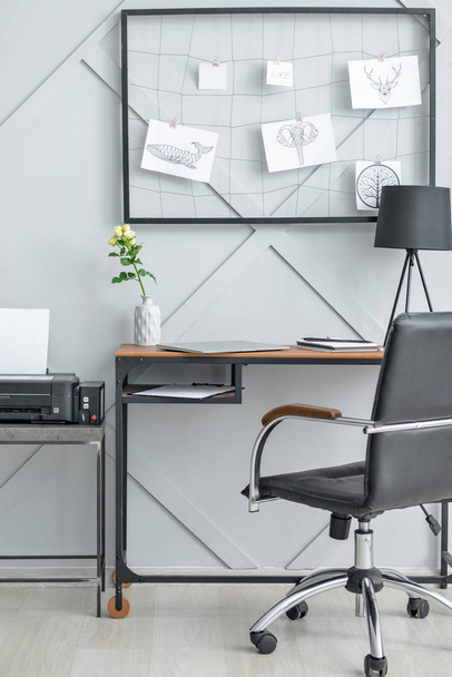 Stylish comfortable workplace with moodboard in modern room - Valokuva, kuva