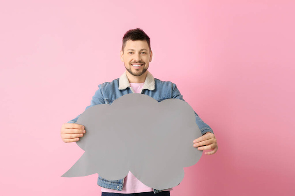 Man with blank speech bubble on color background - Photo, image