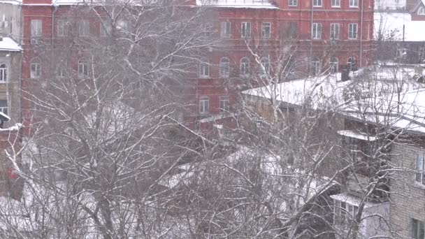Luxury home during heavy snowfall and snow masses on the roof. winter. celebratory date - Кадри, відео