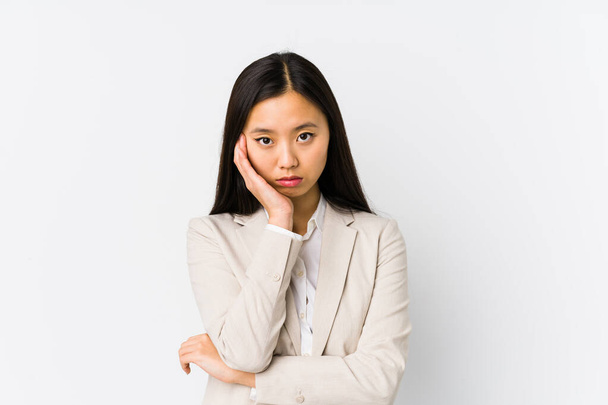 Young chinese business woman isolated who is bored, fatigued and need a relax day. - Foto, Imagen