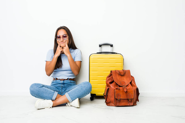 Young mixed race indian woman ready to go to travel doubting between two options. - Photo, Image